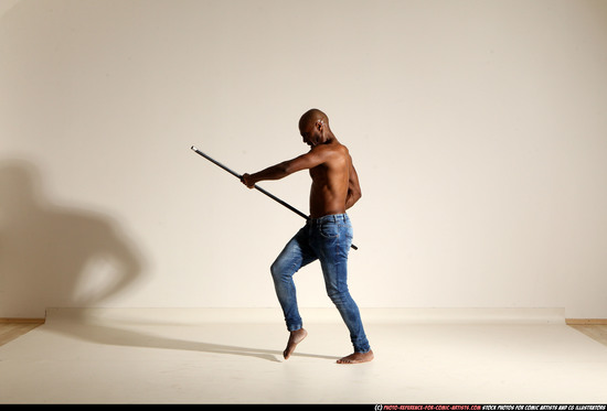 Man Adult Athletic Black Fighting with spear Moving poses Pants