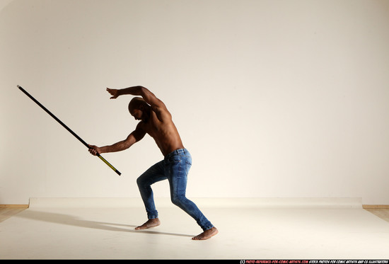 Man Adult Athletic Black Fighting with spear Moving poses Pants