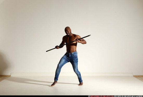 Man Adult Athletic Black Fighting with spear Moving poses Pants