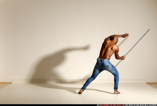 Man Adult Athletic Black Fighting with spear Moving poses Pants