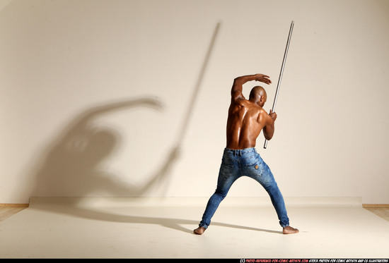 Man Adult Athletic Black Fighting with spear Moving poses Pants