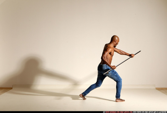 Man Adult Athletic Black Fighting with spear Moving poses Pants