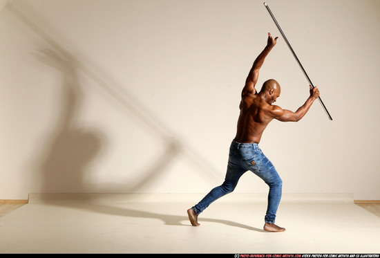 Man Adult Athletic Black Fighting with spear Moving poses Pants