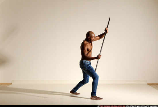 Man Adult Athletic Black Fighting with spear Moving poses Pants