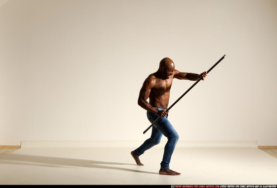 Man Adult Athletic Black Fighting with spear Moving poses Pants