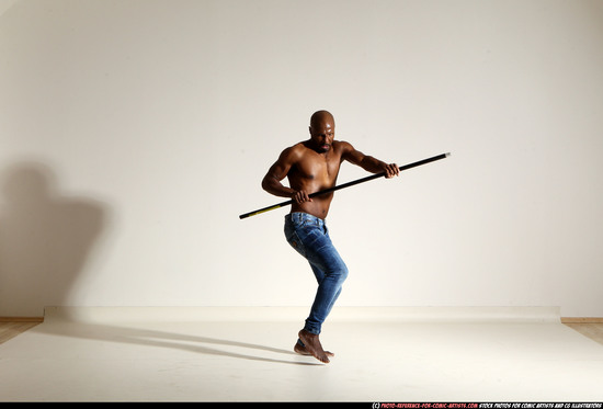 Man Adult Athletic Black Fighting with spear Moving poses Pants