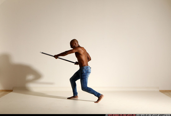 Man Adult Athletic Black Fighting with spear Moving poses Pants