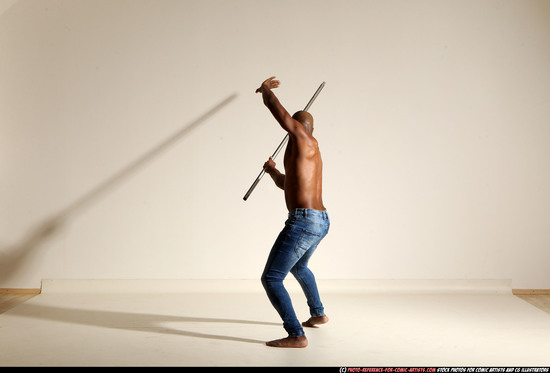 Man Adult Athletic Black Fighting with spear Moving poses Pants