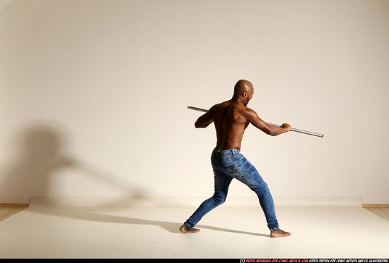 Man Adult Athletic Black Fighting with spear Moving poses Pants