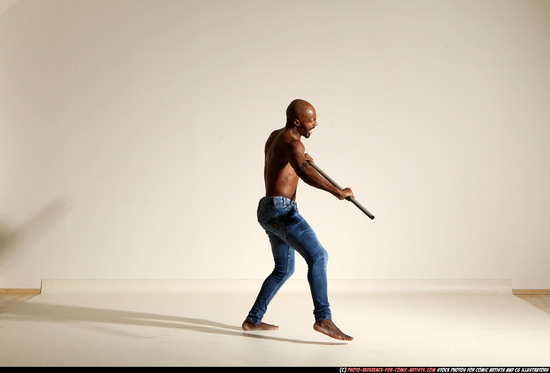 Man Adult Athletic Black Fighting with spear Moving poses Pants