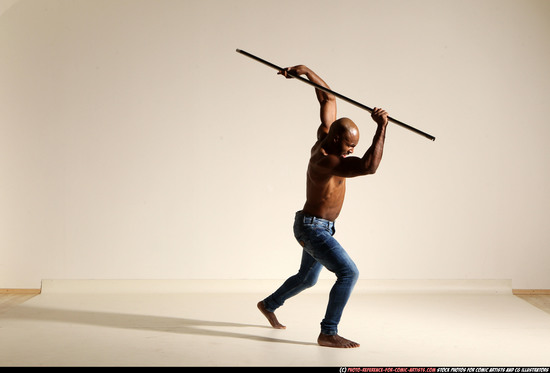 Man Adult Athletic Black Fighting with spear Moving poses Pants