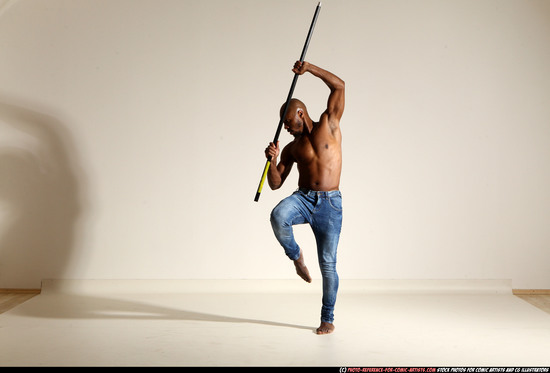 Man Adult Athletic Black Fighting with spear Moving poses Pants