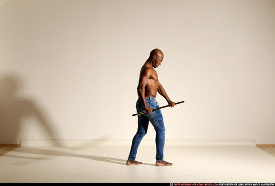 Man Adult Athletic Black Fighting with spear Moving poses Pants