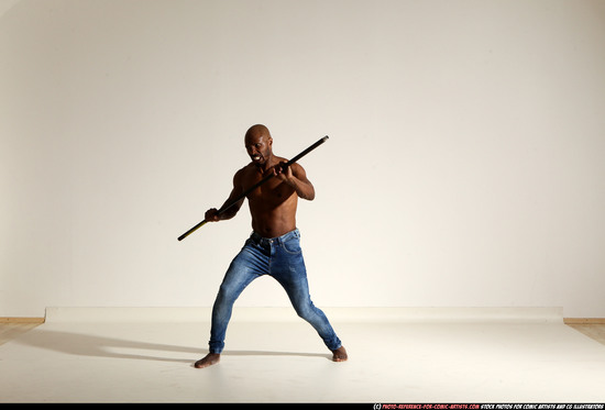 Man Adult Athletic Black Fighting with spear Moving poses Pants