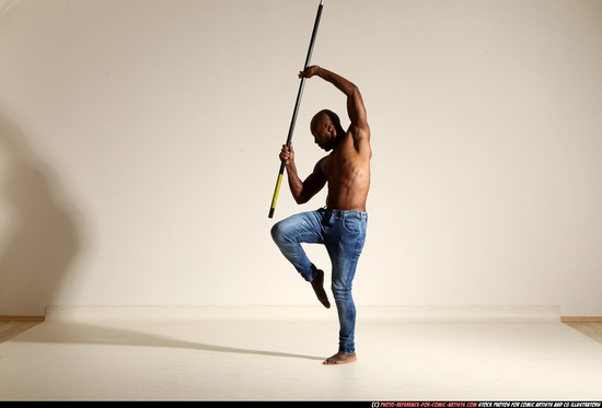 Man Adult Athletic Black Fighting with spear Moving poses Pants