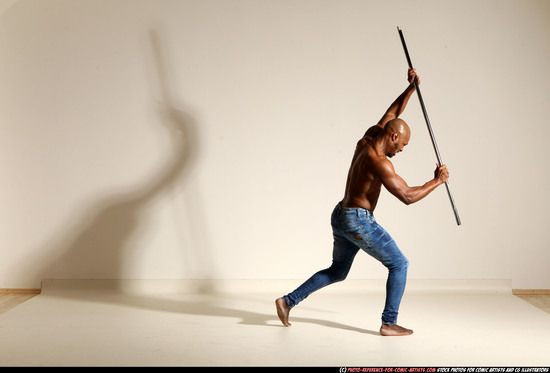 Man Adult Athletic Black Fighting with spear Moving poses Pants