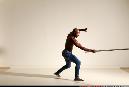 Man Adult Athletic Black Fighting with spear Moving poses Pants