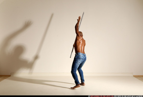 Man Adult Athletic Black Fighting with spear Moving poses Pants