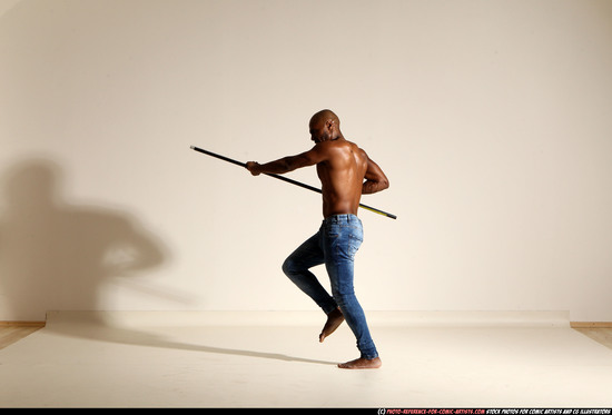 Man Adult Athletic Black Fighting with spear Moving poses Pants