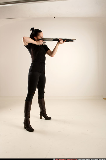 Woman Adult Athletic White Standing poses Casual Fighting with shotgun