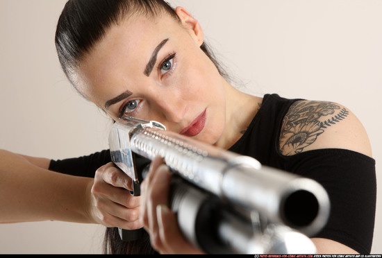 Woman Adult Athletic White Standing poses Casual Fighting with shotgun