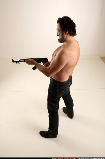 Man Old Average White Fighting with submachine gun Standing poses Pants