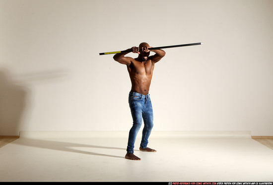 Man Adult Athletic Black Fighting with spear Moving poses Pants