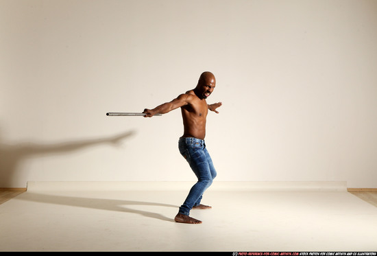 Man Adult Athletic Black Fighting with spear Moving poses Pants