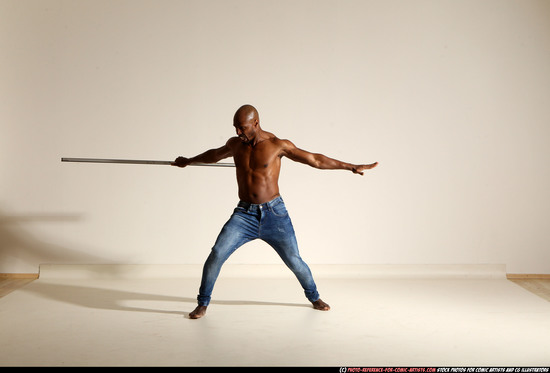 Man Adult Athletic Black Fighting with spear Moving poses Pants