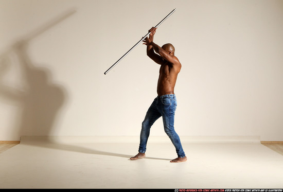 Man Adult Athletic Black Fighting with spear Moving poses Pants