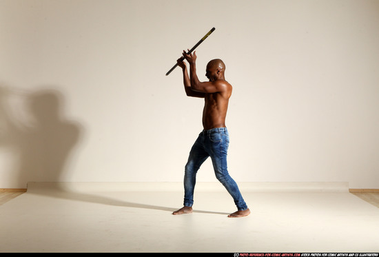 Man Adult Athletic Black Fighting with spear Moving poses Pants