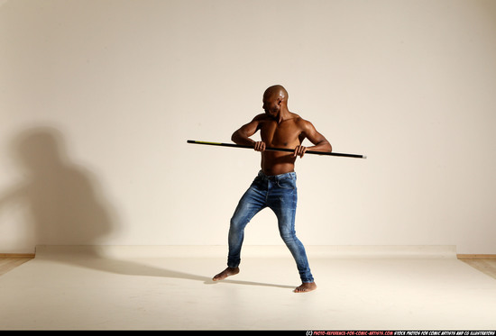 Man Adult Athletic Black Fighting with spear Moving poses Pants