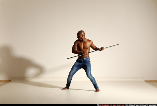 Man Adult Athletic Black Fighting with spear Moving poses Pants