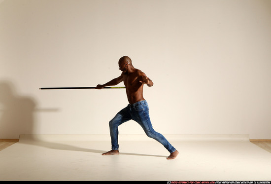 Man Adult Athletic Black Fighting with spear Moving poses Pants