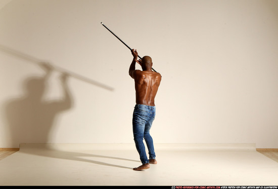 Man Adult Athletic Black Fighting with spear Moving poses Pants