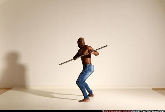 Man Adult Athletic Black Fighting with spear Moving poses Pants