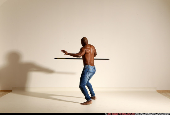 Man Adult Athletic Black Fighting with spear Moving poses Pants