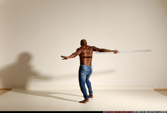 Man Adult Athletic Black Fighting with spear Moving poses Pants