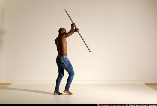 Man Adult Athletic Black Fighting with spear Moving poses Pants