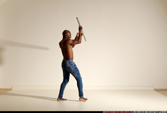 Man Adult Athletic Black Fighting with spear Moving poses Pants