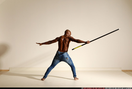 Man Adult Athletic Black Fighting with spear Moving poses Pants