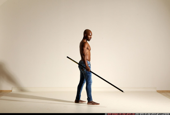 Man Adult Athletic Black Fighting with spear Moving poses Pants