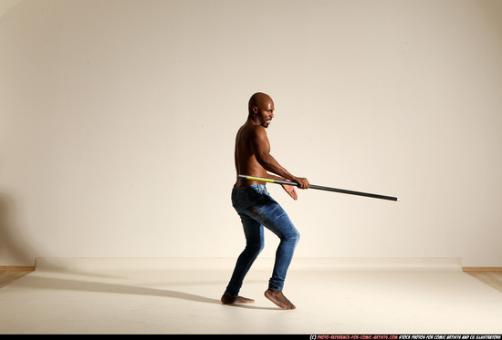 Man Adult Athletic Black Fighting with spear Moving poses Pants