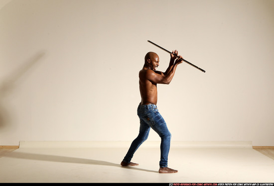 Man Adult Athletic Black Fighting with spear Moving poses Pants