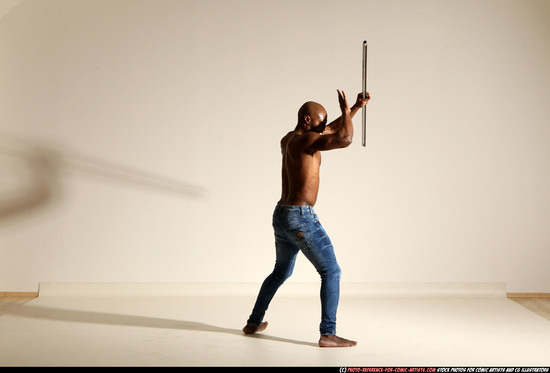 Man Adult Athletic Black Fighting with spear Moving poses Pants