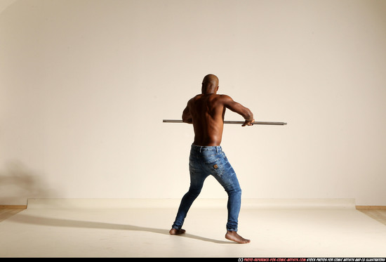 Man Adult Athletic Black Fighting with spear Moving poses Pants