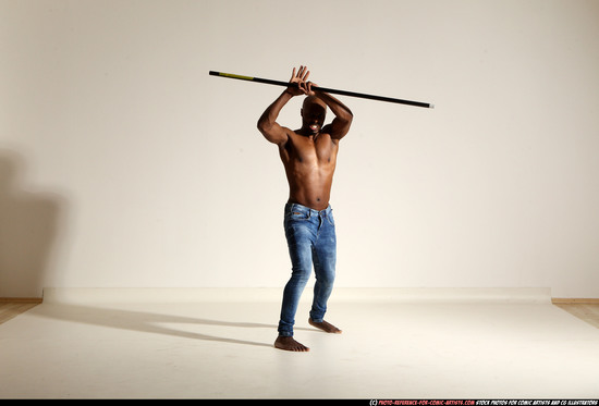 Man Adult Athletic Black Fighting with spear Moving poses Pants