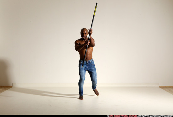 Man Adult Athletic Black Fighting with spear Moving poses Pants