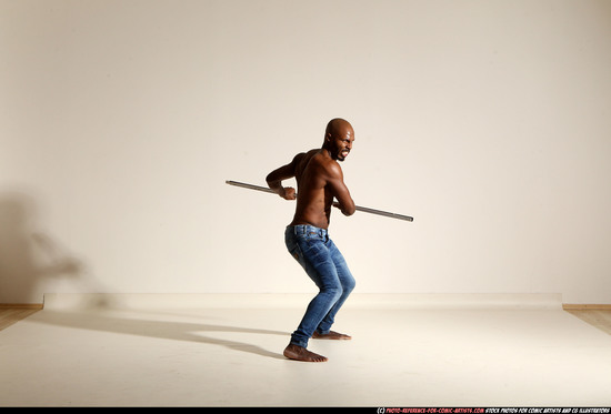 Man Adult Athletic Black Fighting with spear Moving poses Pants