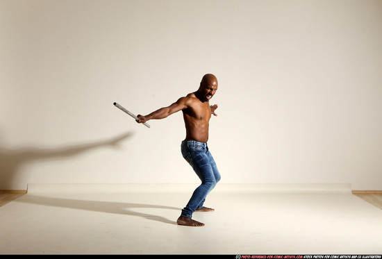 Man Adult Athletic Black Fighting with spear Moving poses Pants